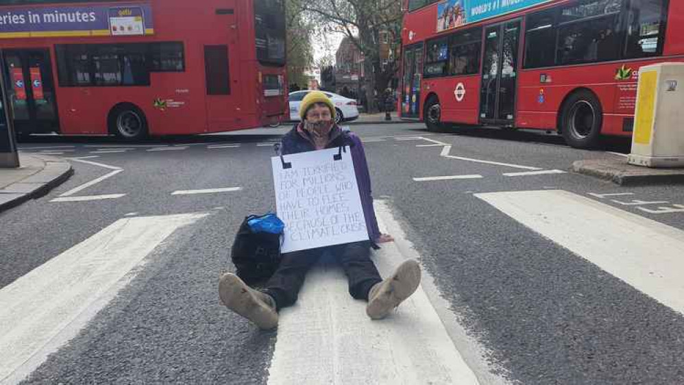 Fio, 72-year-old artist from Furzedown, blocking traffic in Sloane Street Fio, 72-year-old artist from Furzedown, blocking traffic in Sloane Street