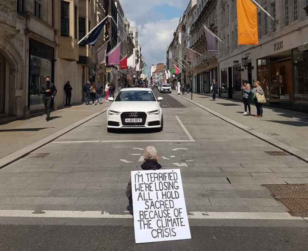 Nathaniel, 48-year-old filmmaker from Balham, sitting at the end of Old Bond Street Nathaniel, 48-year-old filmmaker from Balham, sitting at the end of Old Bond Street