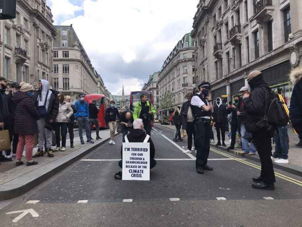 Bernard, 57-year-old Southfields health worker, stopping traffic at Oxford Circus Bernard, 57-year-old Southfields health worker, stopping traffic at Oxford Circus