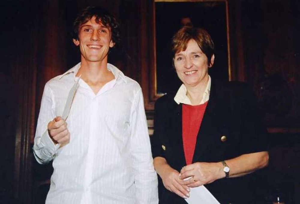 Presenting prizes to the winner of a young writer's competition