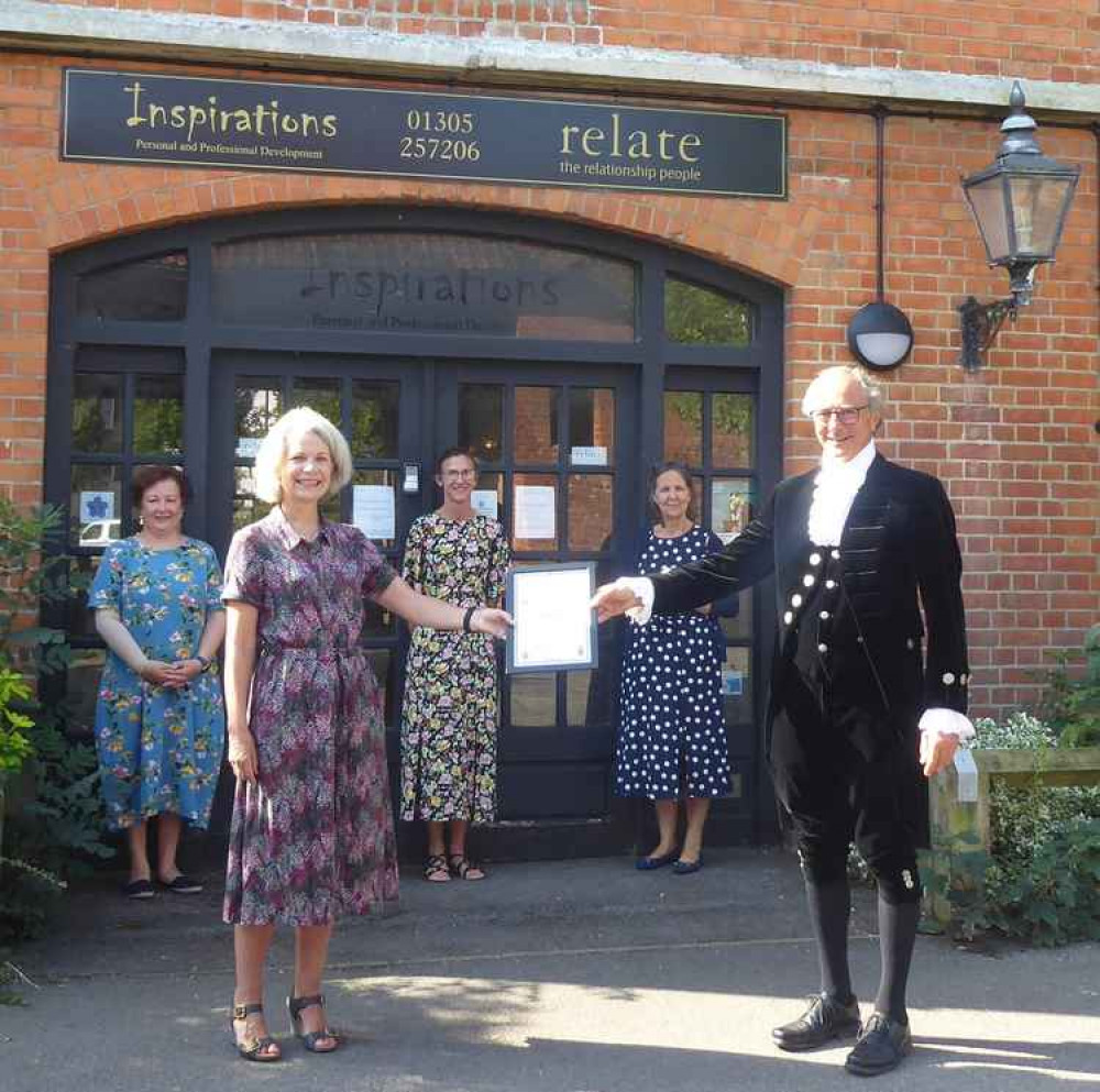 High Sheriff of Dorset, George Streatfeild, presents Sian and her team at Relate with a High Sheriff Award