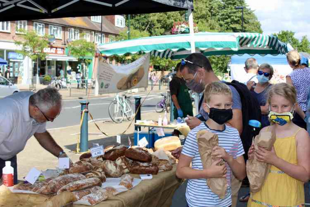 Youngsters with their loaves of bread