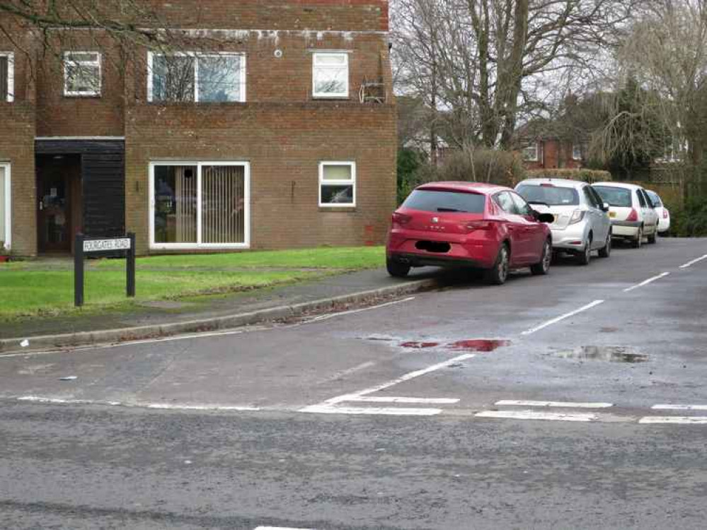 Cars park don the pavement in Fourgates Road