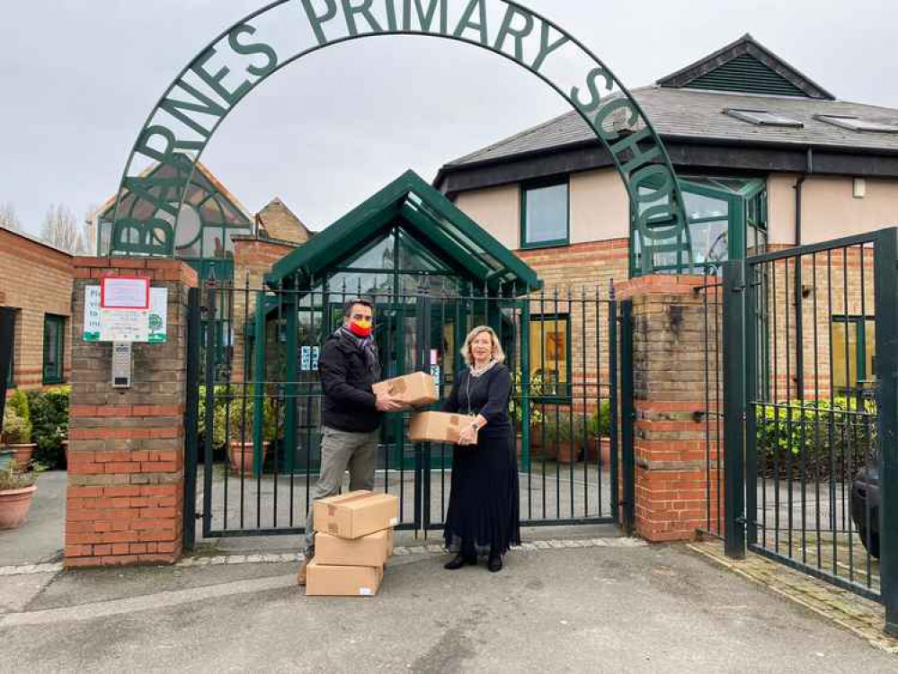 Club volunteer Peter Scott delivers tech to Barnes Primary School