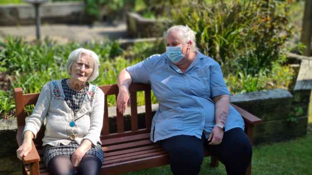 Residents and staff enjoying Cheriton Care Home's garden