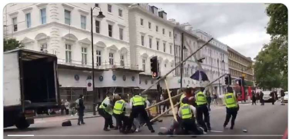 The police stopping the protests. Credit: Metropolitan Police.