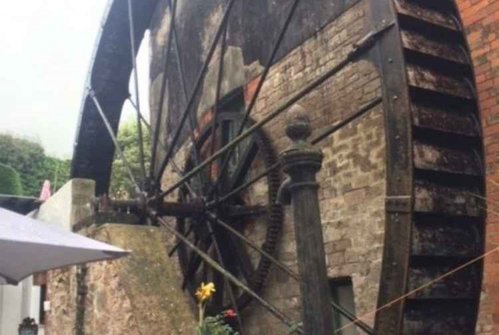 The huge water wheel towering over the courtyard