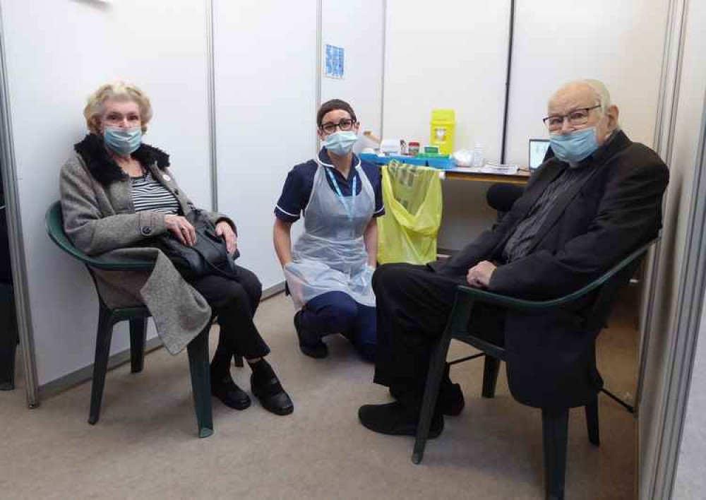 Jim and Jean Copeland with nurse Kate Nichols - among the first people to have the vaccine at the Exmouth site.