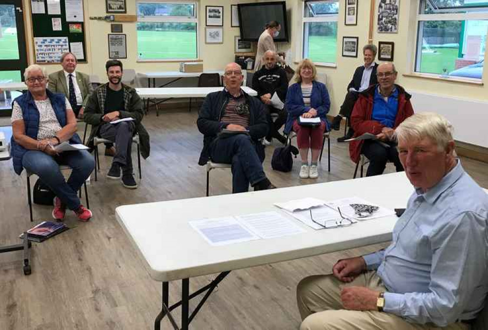 Dorchester town council's planning and environment chairman Cllr Robin Potter (foreground) prepares to lead the first face to face meeting for 16 months – held at the town's cricket club