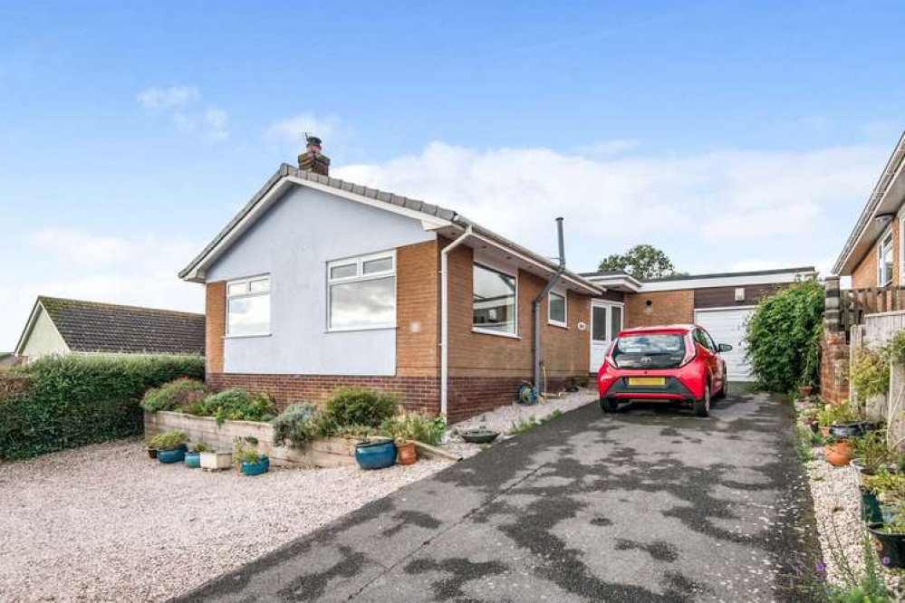 This three-bedroom detached bungalow in Holcombe has fantastic countryside and coastal views