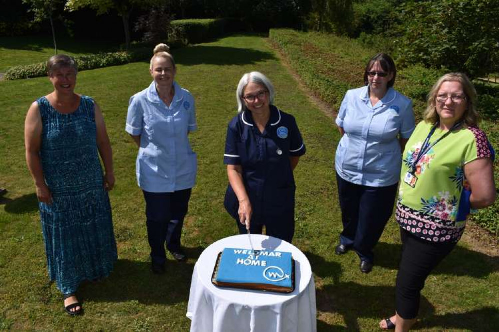 Members of the team celebrate the new Weldmar at Home service with a special cake Members of the team celebrate the new Weldmar at Home service with a special cake