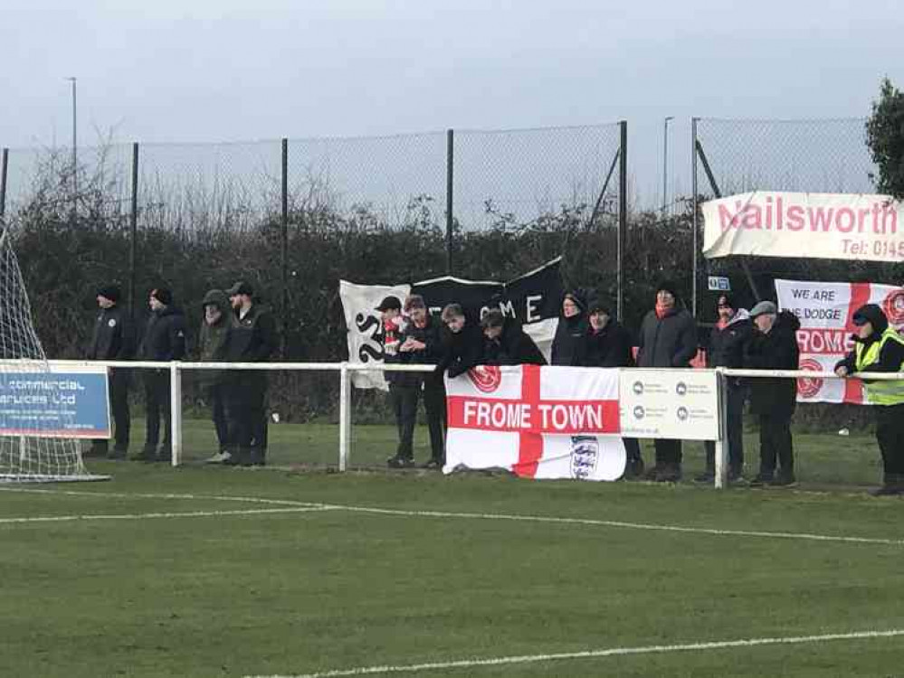 Away fans enjoy the action