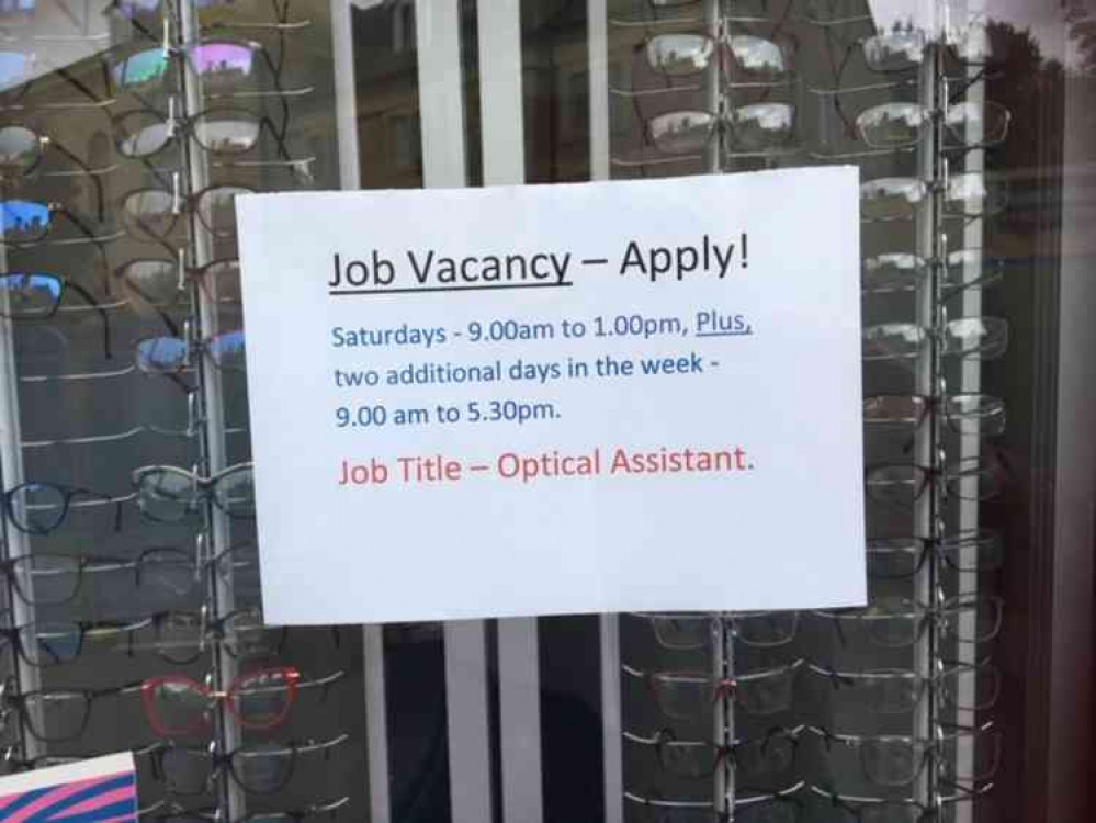 The job is advertised in the window