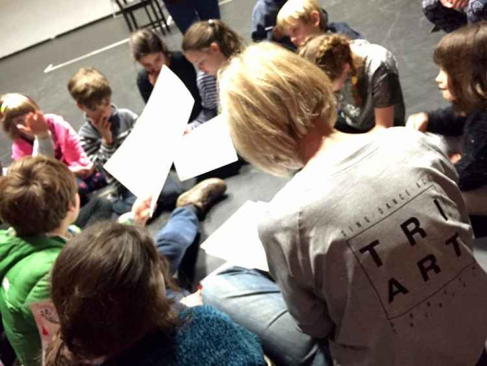 Children join the theatre director to make a Play-In-A-Day