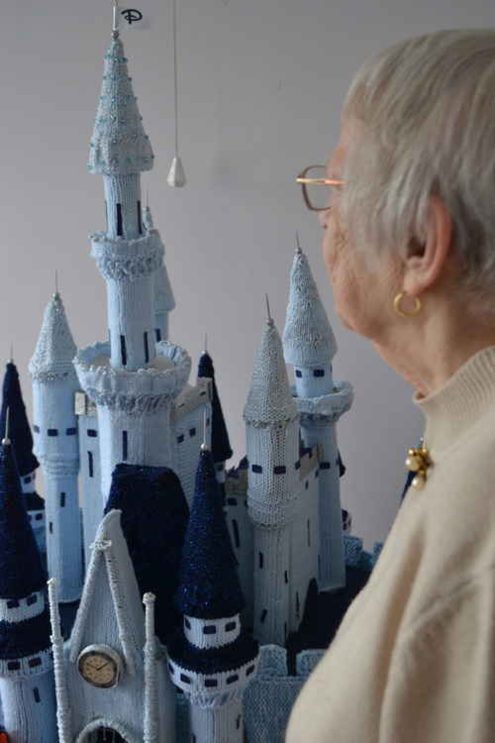 Pat next to her castle, all made without any pattern