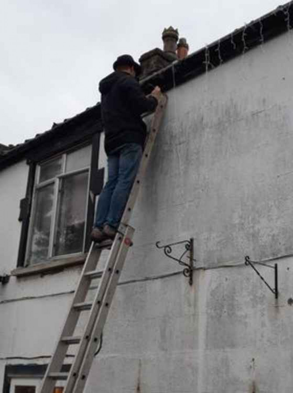 Tony starts putting up the lights at his home on The Butts