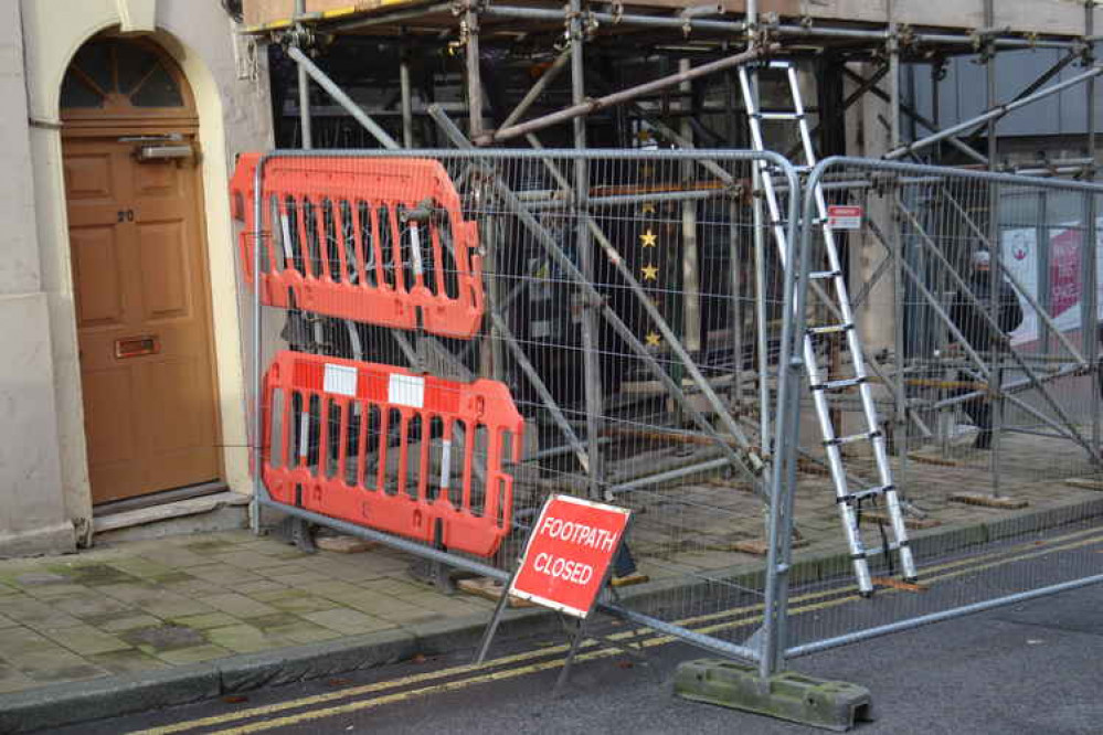 The road and the pavement alongside this Bath Street address are cordoned off The road and the pavement alongside this Bath Street address are cordoned off