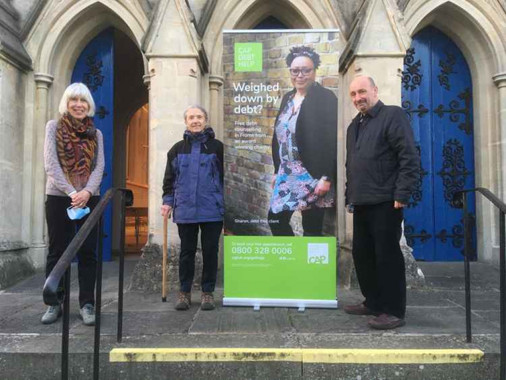 CAP Debt Centre Manager, Phil Gray, on the steps of Trinity Church with volunteers