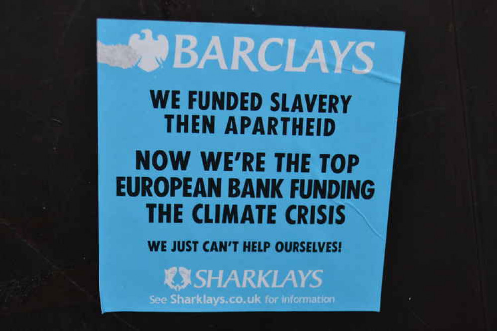 Stickers on the doors of the Barclays bank in Frome mark a new strategy for Extinction Rebellion Stickers on the doors of the Barclays bank in Frome mark a new strategy for Extinction Rebellion
