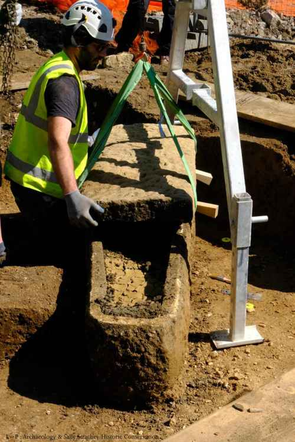 The Roman sarcophagus found at Bath's Sydney Gardens being lifted out