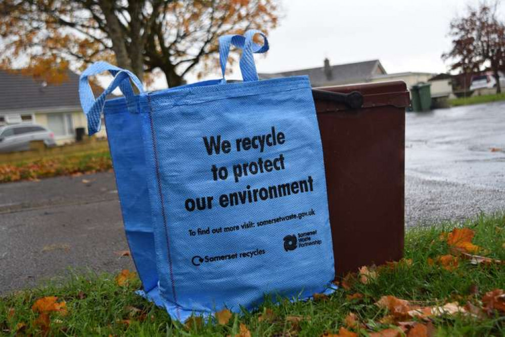 A Bright Blue Bag And Food Waste Caddy Ready For Kerbside Collection. CREDIT: Somerset Waste Partnership. Free to use for all BBC wire partners