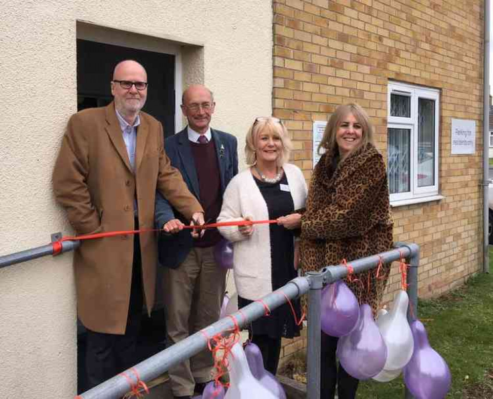 Cutting the ribbon on the new volunteer library