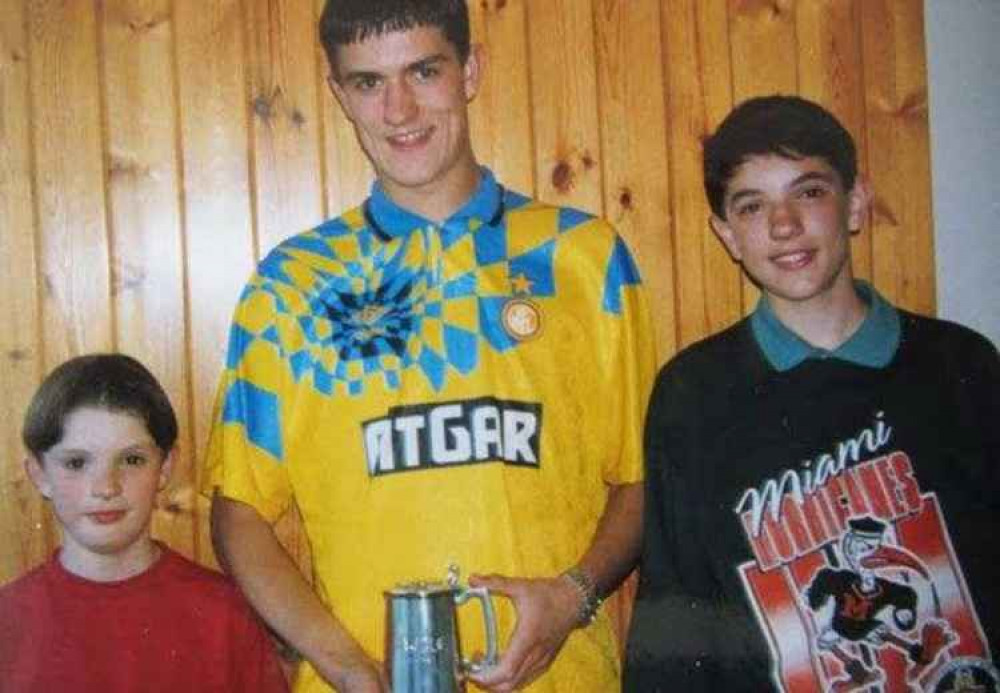 Andrew (centre) with younger brothers Peter (left) and James (right)