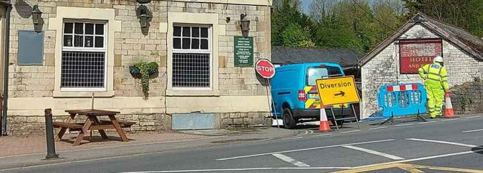 The road turns on past the Radstock Hotel