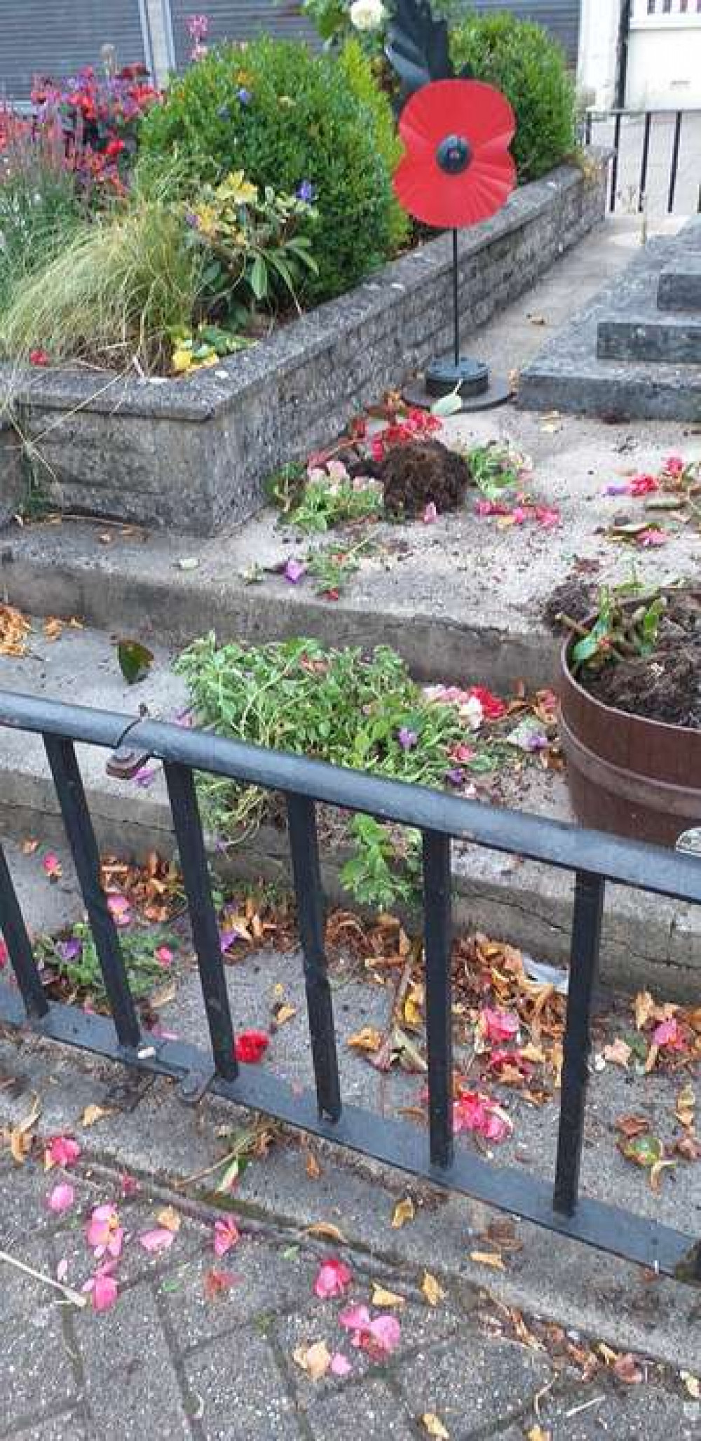 The plants and flowers were strewn across the High Street The plants and flowers were strewn across the High Street