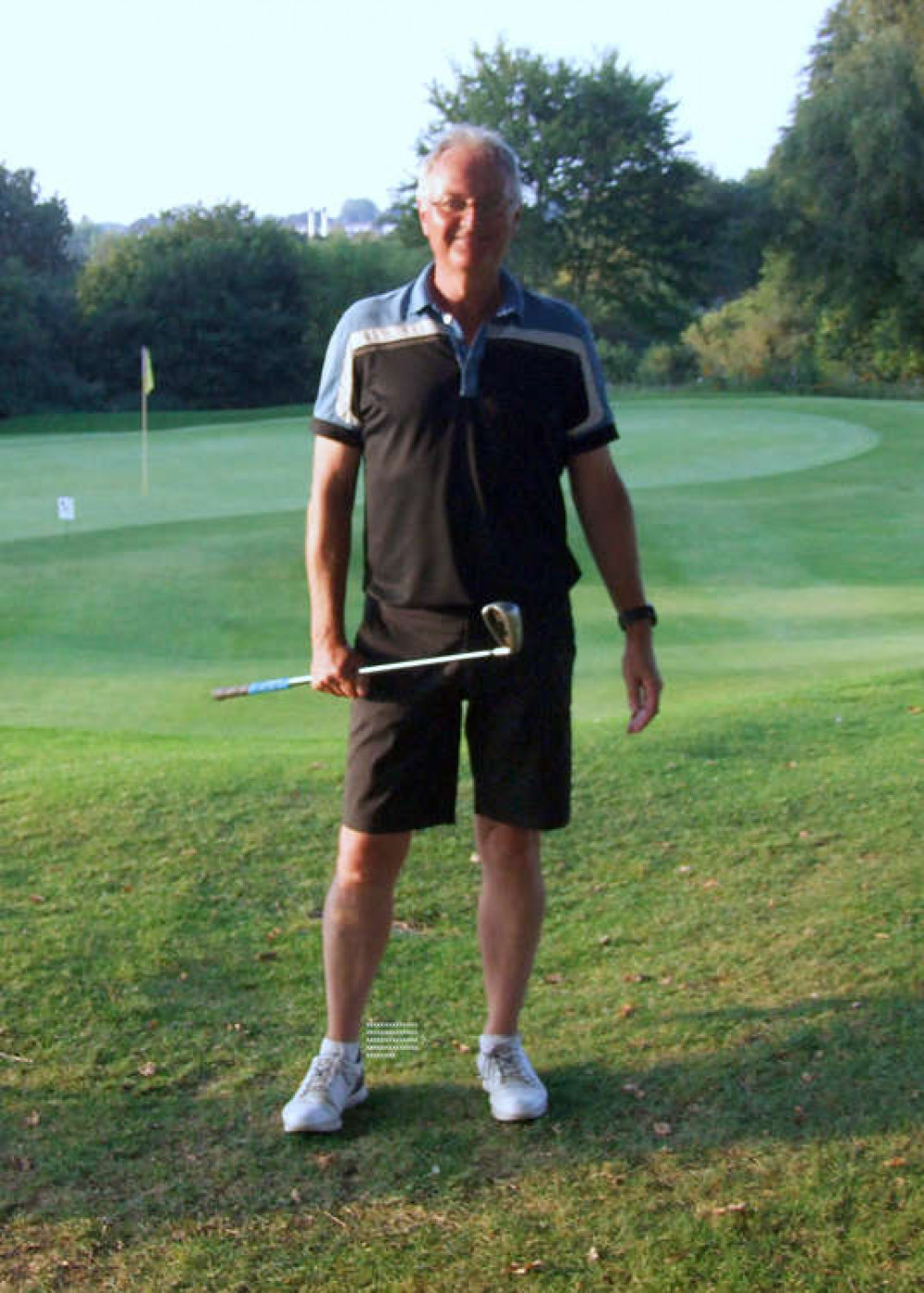 Photo of Tony Waldron attached by the 18th green of Yeovil's Old Course with his trusted hole in one 9 iron