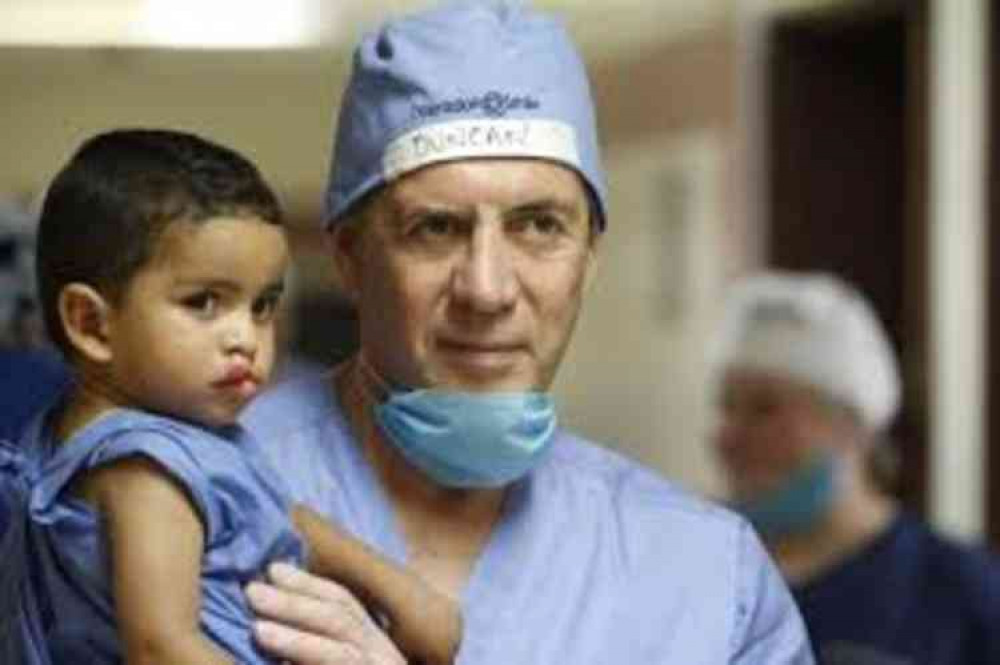 Duncan Bannatyne meets a young patient on a trip with Operation Smile UK