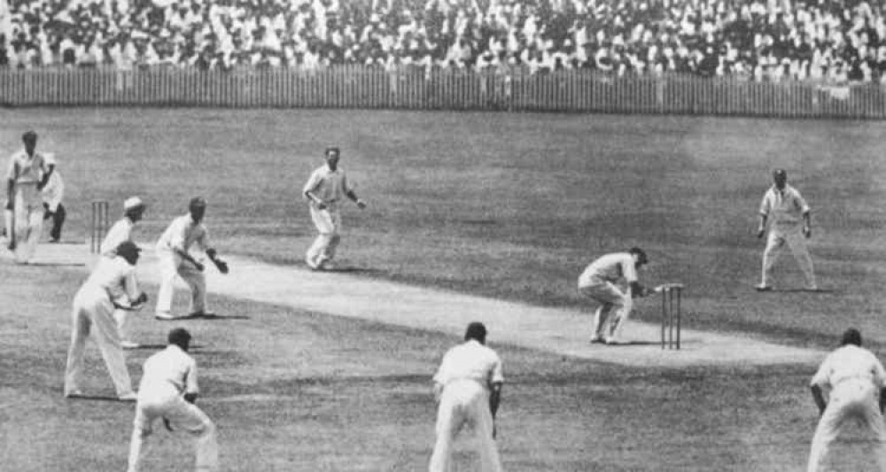 The 4th Test at Brisbane. Bill Woodfull ducks beneath a Larwood bouncer.