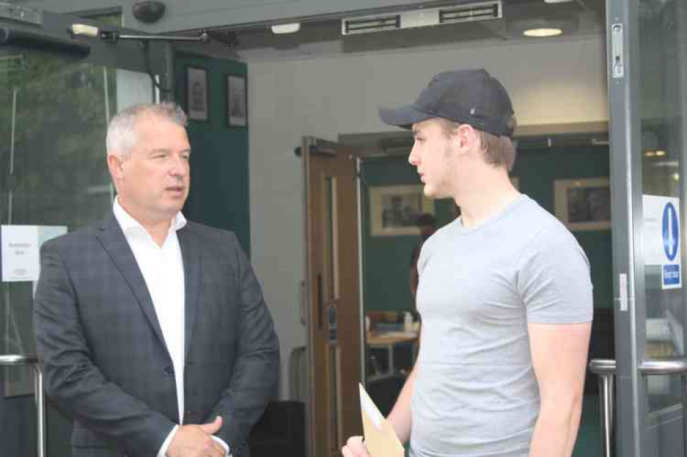 Liam Berry talks to Ortu Sixth Form head Ceri Evans after getting his results.