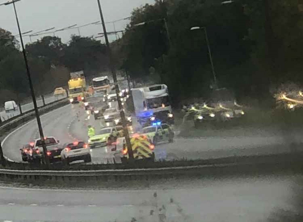 Traffic being allowed to exit at the interchange.