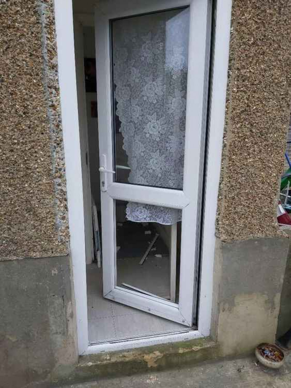 Police battered through this door to gain entry and found drugs and weapons. Police battered through this door to gain entry and found drugs and weapons.