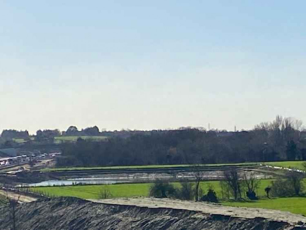 The huge new pond adjacent to the A13.  It was created to allow work on an underground pipe to take place says Thurrock Council.