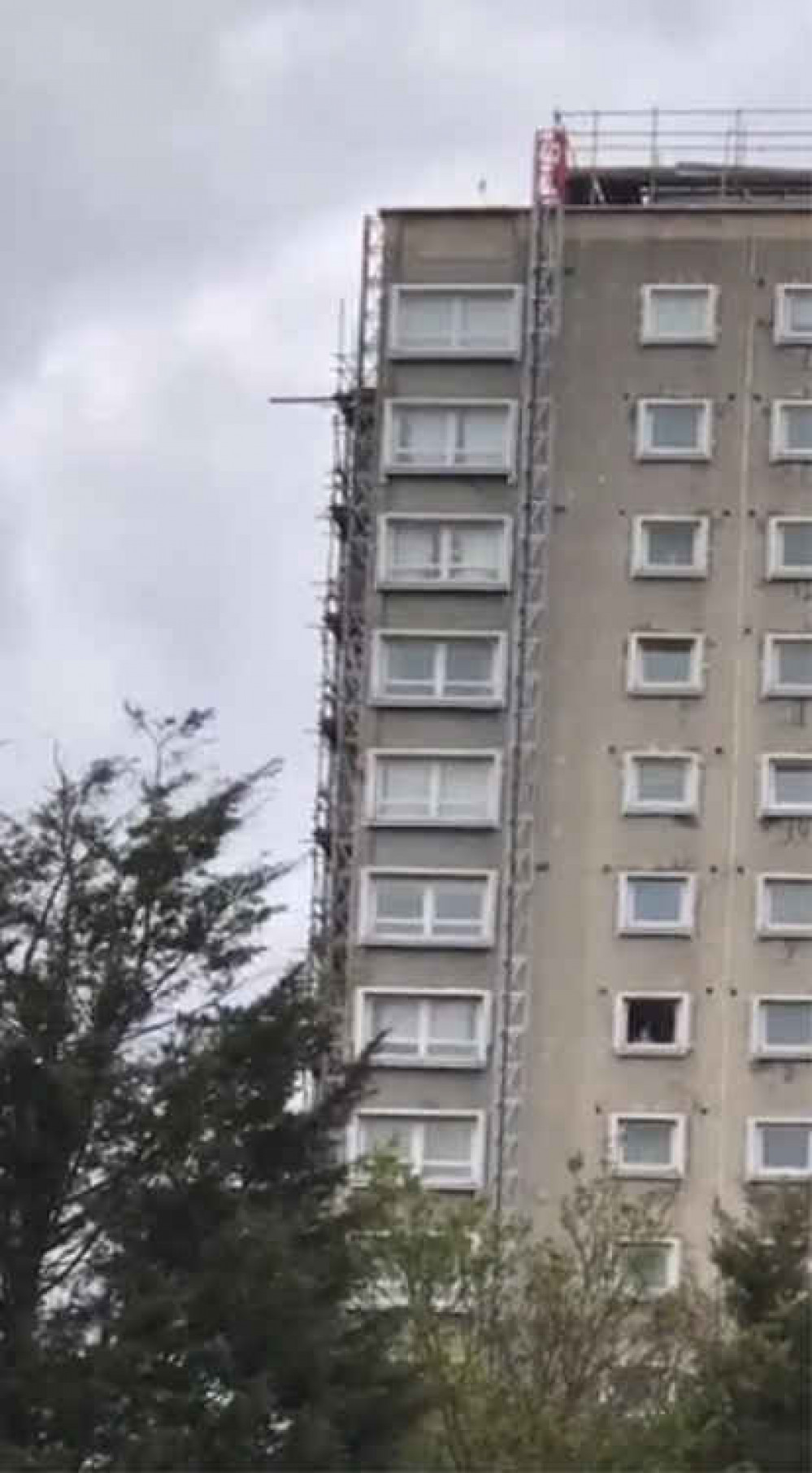 A loose plank hangs precariously from Davall House yesterday evening A loose plank hangs precariously from Davall House yesterday evening