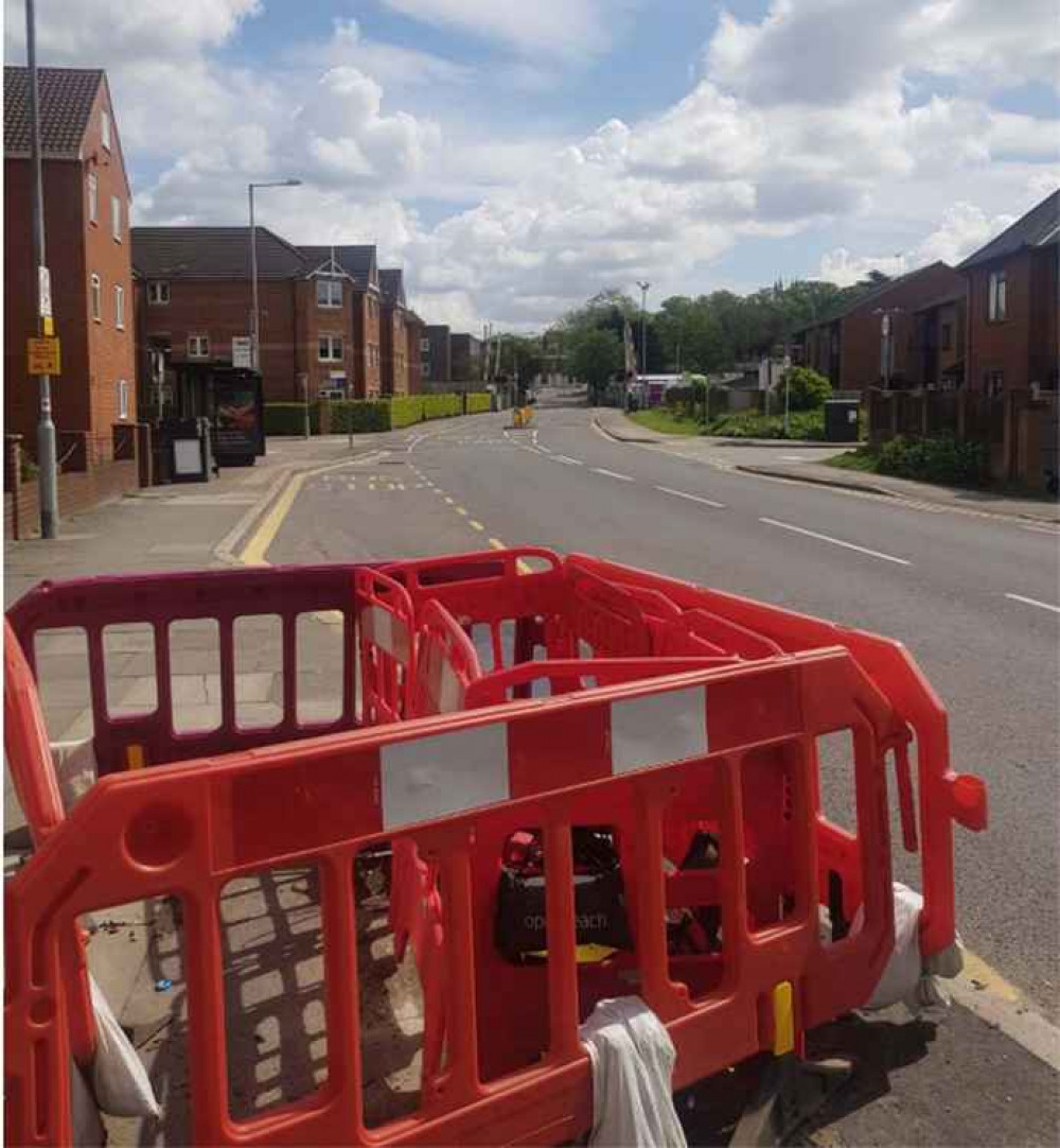 Pavement blocker - one month on, the hole and barriers are still there.