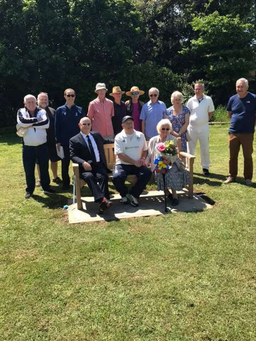 Club members, family and friends at the unveiling of the bench in June.