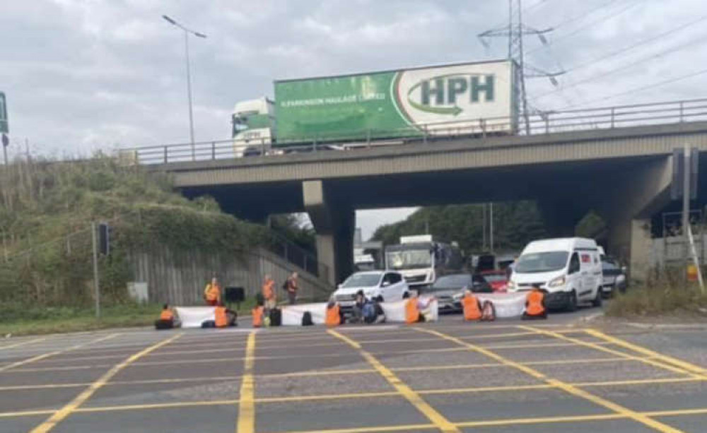 Campaigners block the roundabout at Lakeside today.