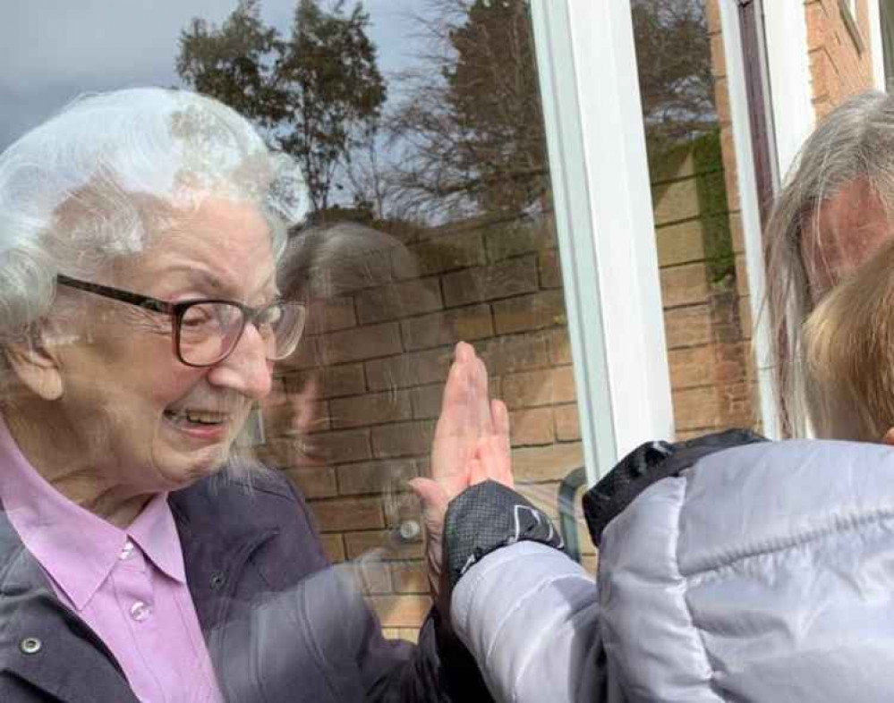 Marjorie enjoying a lockdown visit by her great grandson