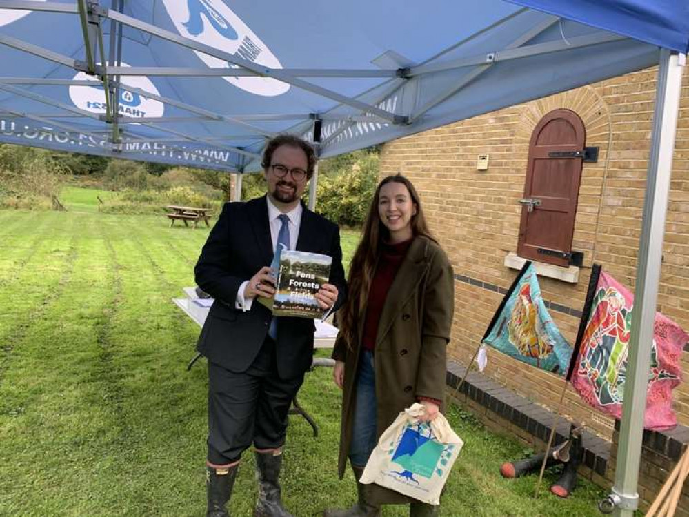 Environment engagement officer Aisling Woodhead presents Fens, Forests and Fields, the book which celebrates the landscape of the Land of the Fanns, to Cllr James Halden