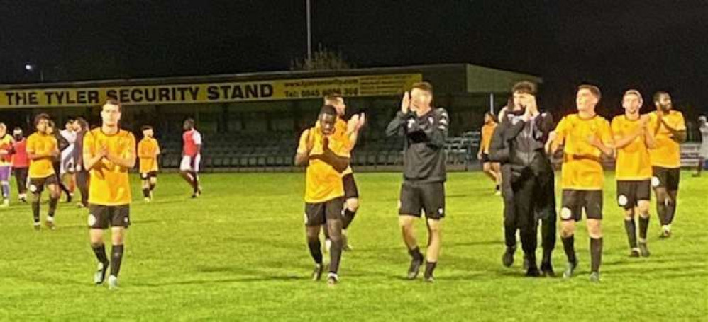 East Thurrock players applaud their supporters after tonight's win.