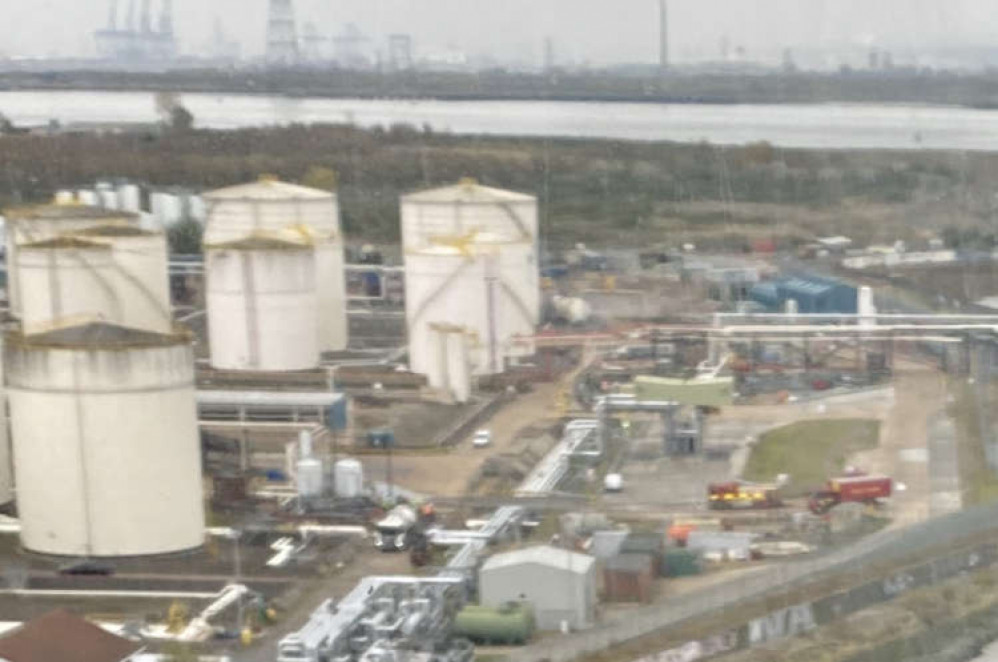 View from the bridge: Firefighters at the scene of the leak.