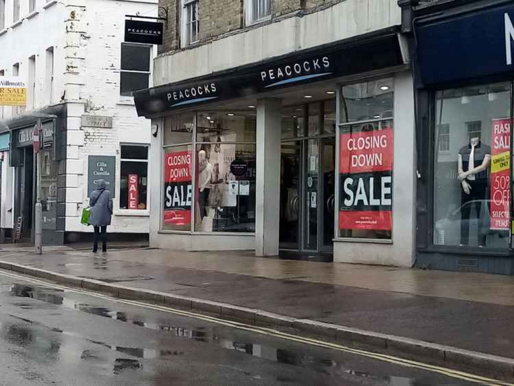 Closing down sale signs in Peacocks, Bridport