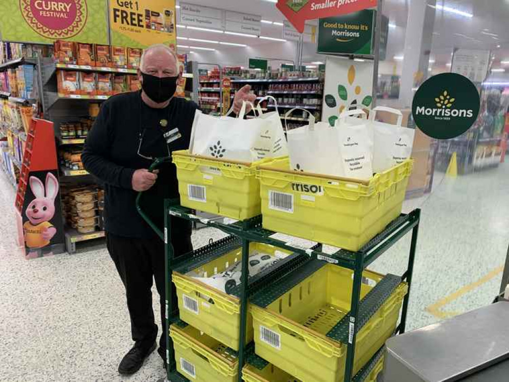 Nick, who is in charge of doorstep deliveries at the Bridport store, picks the orders personally then goes out and delivers them