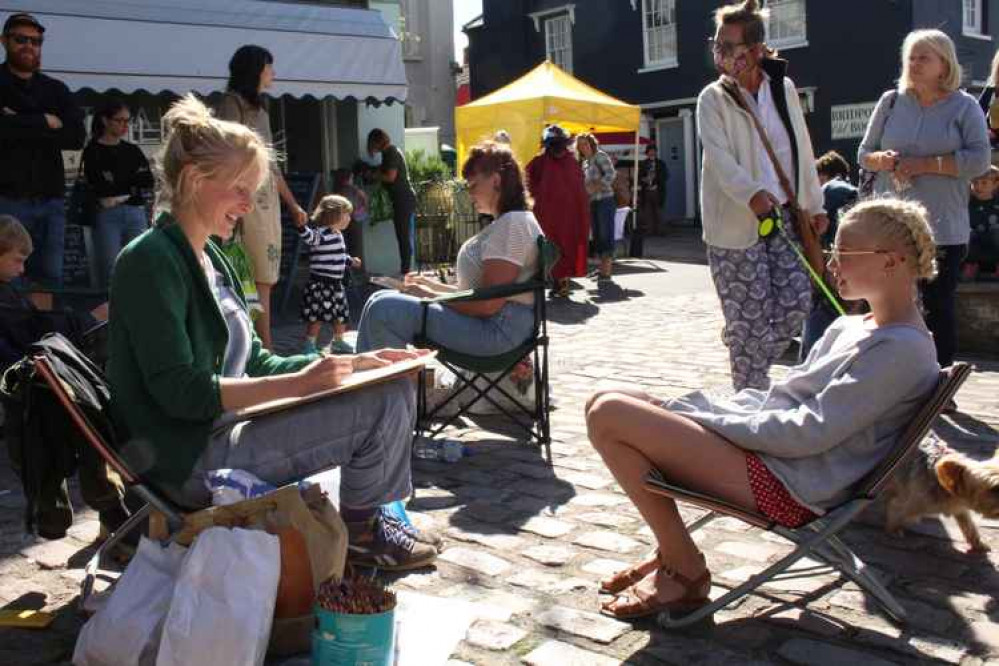 People drawing for The Lyric Theatre's Portrait Challenge