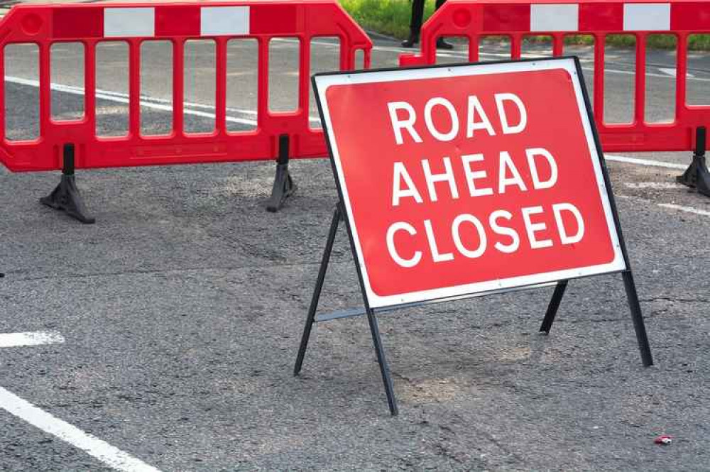 Burton road closed after car hits electricity pole