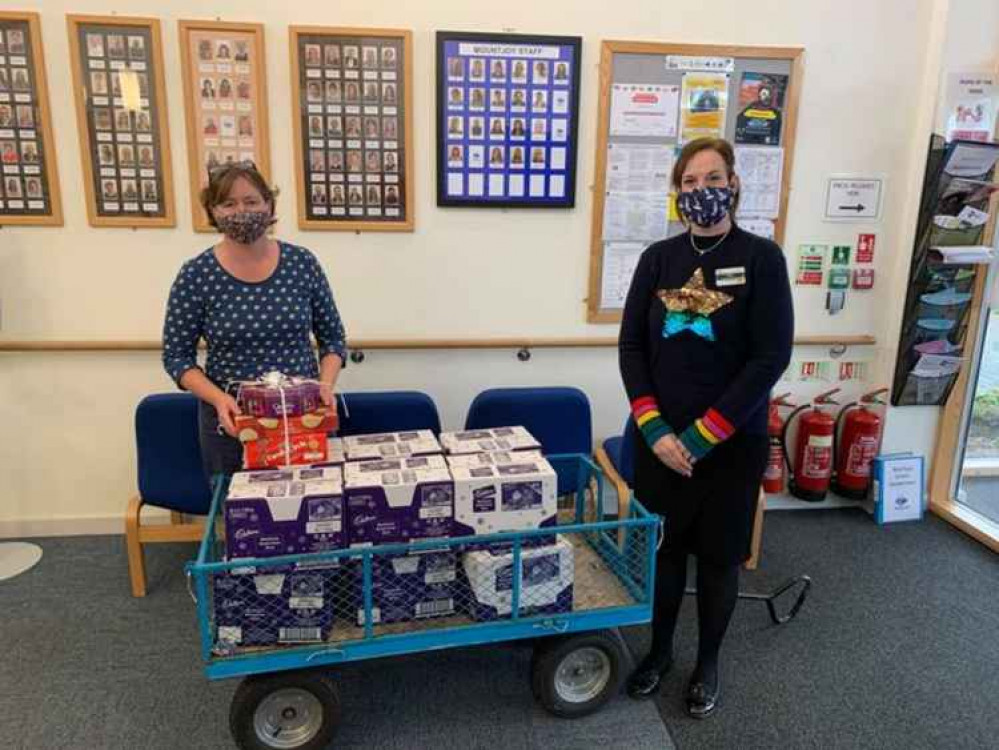 Keira, right, delivering 96 selection boxes to Mountjoy School