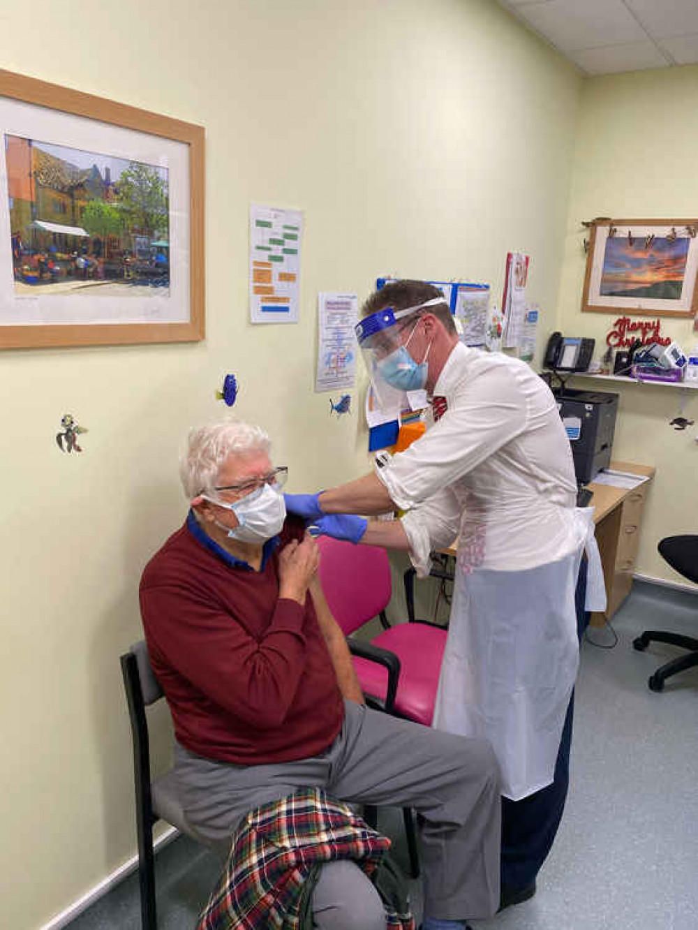 Dr Andy Finucane gives the first Covid vaccine in Bridport to Edward Conisbee